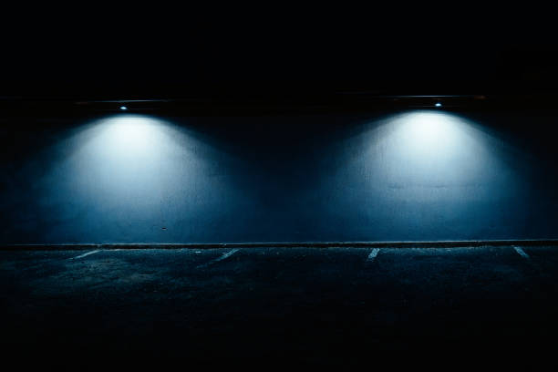 abandoned parking lot illuminated at night - street light parking lot night lot imagens e fotografias de stock