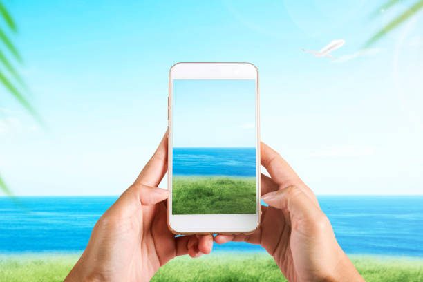 istock Human hand with the mobile phone taking a picture on the field 1338827093