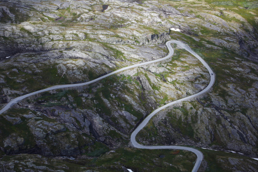 Curvy mountain road winding through the rocky terrain