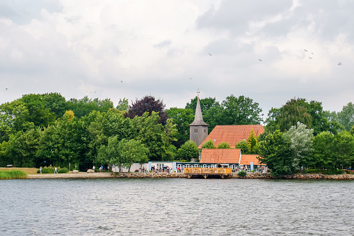 Beautiful Schlei region in Germany, Schleswig Holstein. German landscape in summer. Schlei river and typical houses with thatching, water reed roofs.