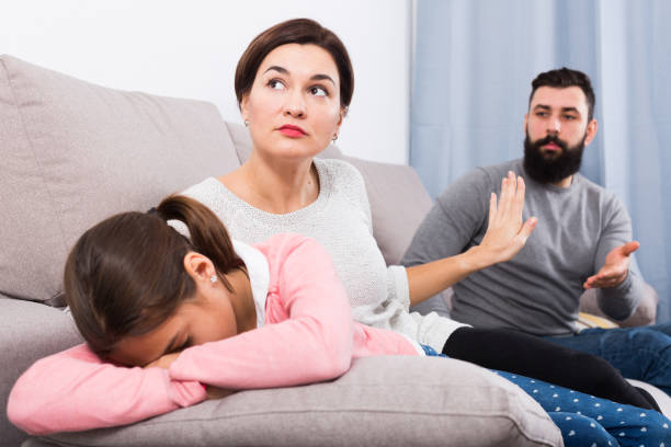 istock Father lecturing wife and daughter 1338828798