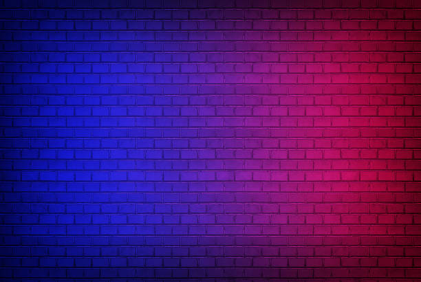 istock Abstract image Lighting Effect red and blue on black brick wall room for background or backdrop. concrete wall gradient color Effect background 1338830746