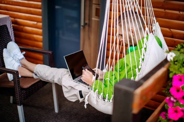 Single person using laptop outdoors during vacation