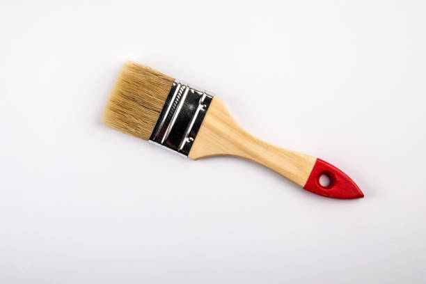 istock Clean paint brush with a wooden handle on a white background 1338833678
