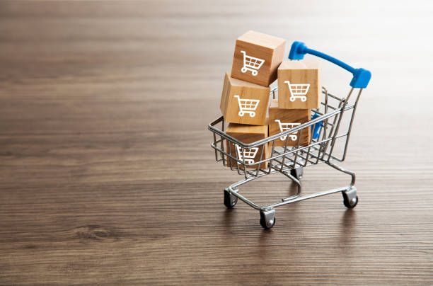 trolley shopping cart which print screen on wooden cubes block. shopping concept - bundle imagens e fotografias de stock