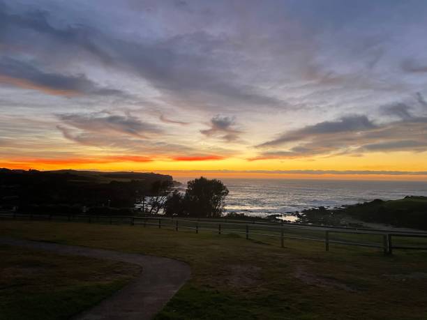 istock Cloudy sunrise by the coast 1338838774