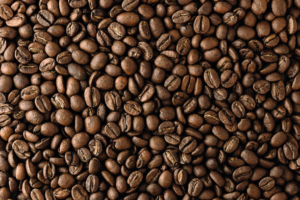istock offee beans texture. coffee beans background. close-up of offee beans top view 1338840963
