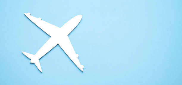 istock model of passenger plane on blue background 1338842862