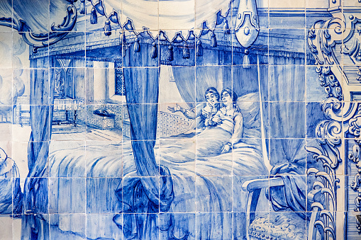 Picture on blue tiles telling the story of a saint on the walls in Santuário do Senhor Santo Cristo dos Milagres - Convent of Our Lady of Hope in Ponta Delgada on the Azorean Island San Miguel. The church is from 1771 and the style has been described as baroque-to-rococo.