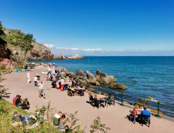 Salcombe, Devon, England - May 31, 2015: Sunny summer weekend  weather drew visitors to the beach at South Sands, Salcombe, Devon