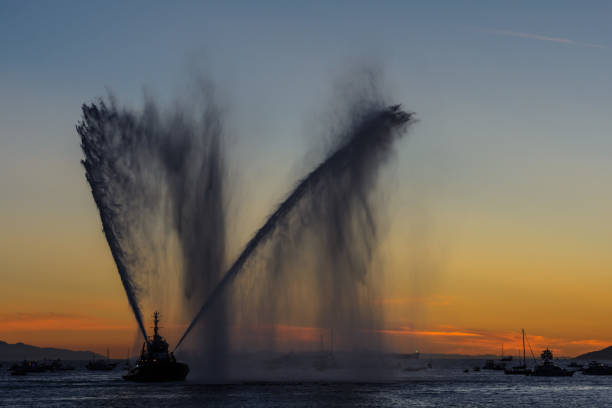 istock sprays water as firefighter boat 1338844783