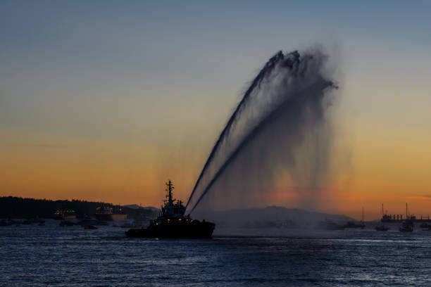 istock sprays water as firefighter boat 1338844803