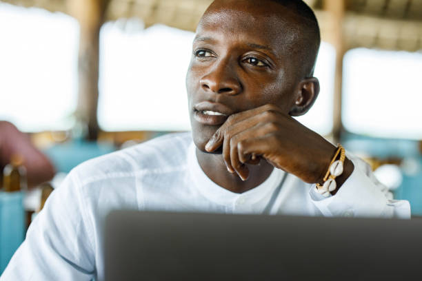istock Thoughtful black businessman working on laptop. 1338845351