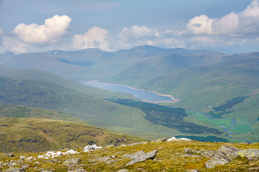 Views of Loch Lyon and Lubreoch power station, dam wall from the summit of Meall Ghaordaidh above Loch Tay in the Scottish Highlands, UK.