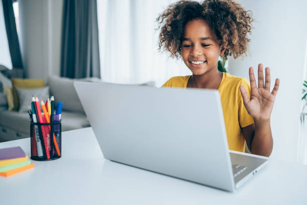 istock Cheerful girl having video call at home. 1338845450