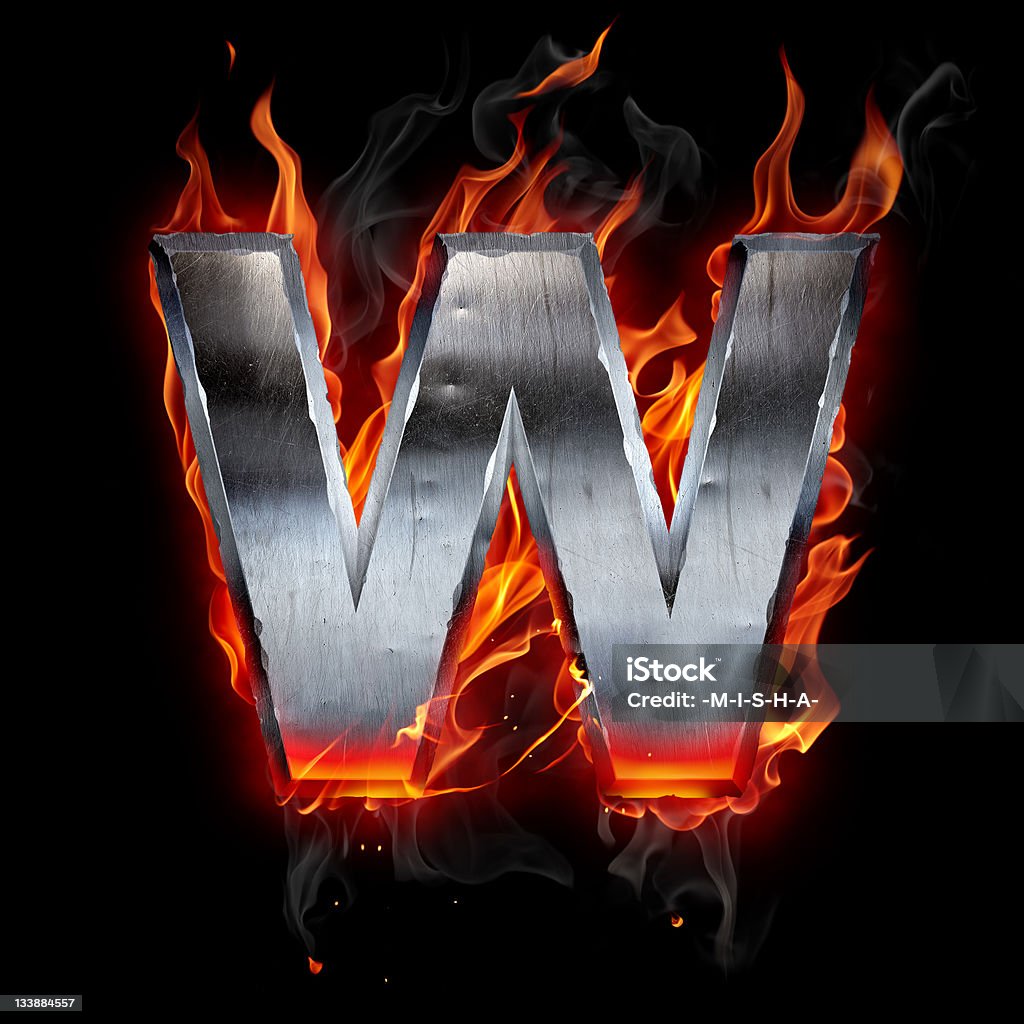 Flaming chrome w logo on black background Metal letter on fire Alphabet Stock Photo
