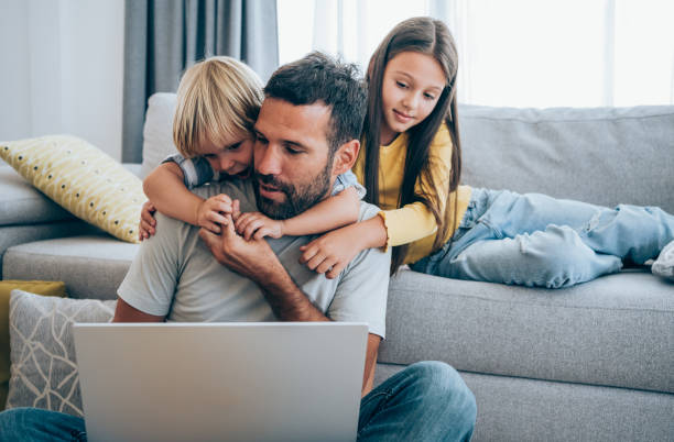 istock Father trying to work from home. 1338846027