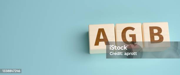 Agb Web Banner The German Abbreviation For Allgemeine Geschäftsbedingungen Built From Letters On Wooden Cubes For The Use As A Web Banner Stock Photo - Download Image Now