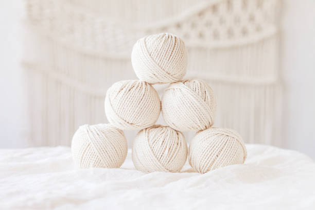istock Handmade macrame braiding and cotton threads. Image good for macrame and handicrafts banners and advertisement.  Copy space 1338847527