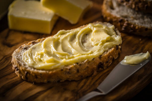 istock Butter spread on a slice of bread 1338847672