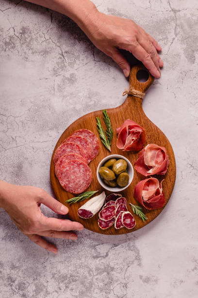 istock Serving board with a set of different meat snacks 1338847794