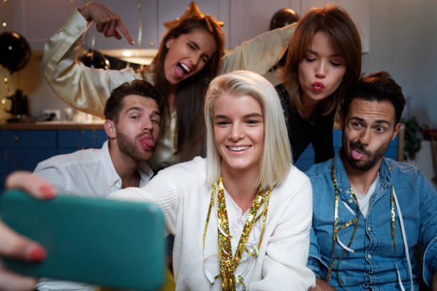 istock Friends taking selfie on the party 1338849639