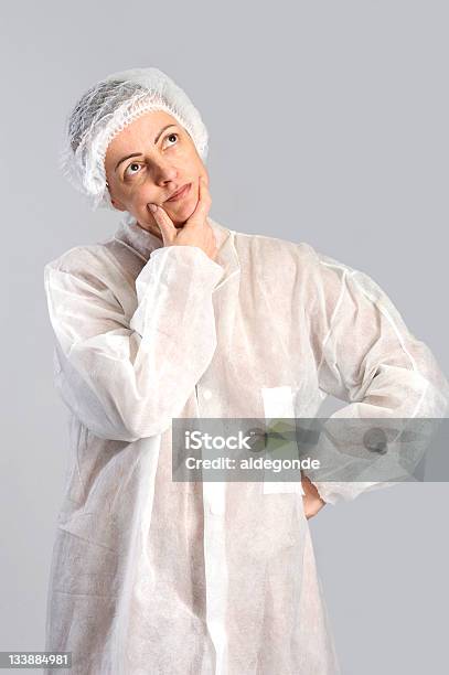 Thinking Female Food Factory Worker Stock Photo - Download Image Now - Adult, Blue-collar Worker, Contemplation