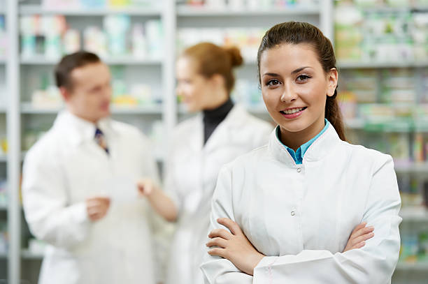 Pharmacy chemist woman in drugstore stock photo
