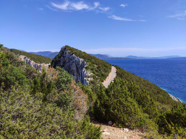 istock Lefkada island green cliffs, sea and driveway road 1338850201