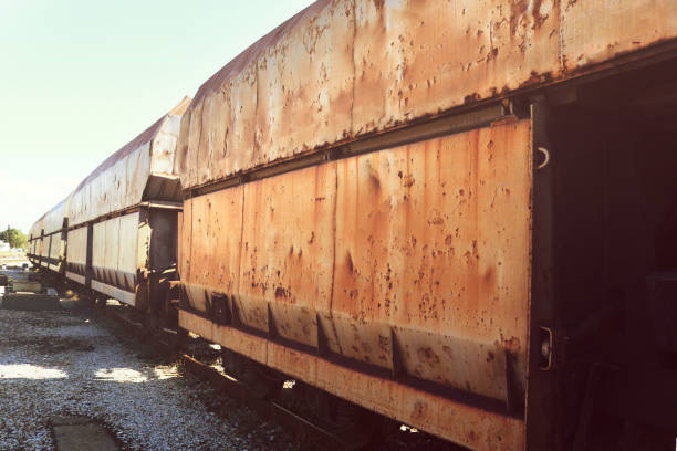 old abandoned train carriages on the railway with rusty  surface - ancient soviet transportation