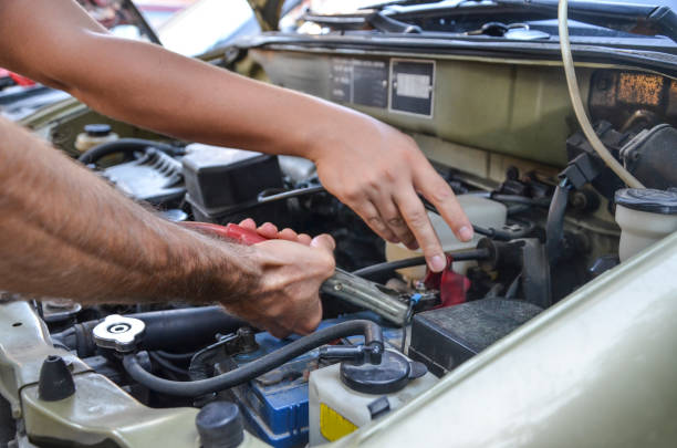 istock Checking the engine of an old car 1338855623