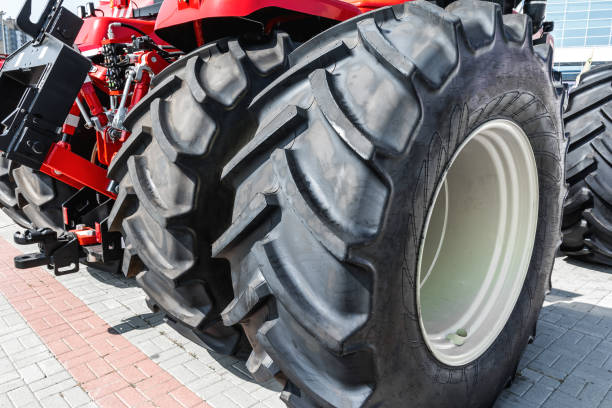 A wheeled tractor with huge high-pass tires in close-up.