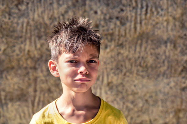 istock sad little boy with tangled hair 1338856926