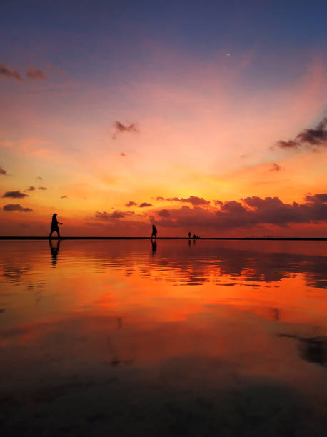 istock Fiery sunset with clouds by the ocean 1338856994