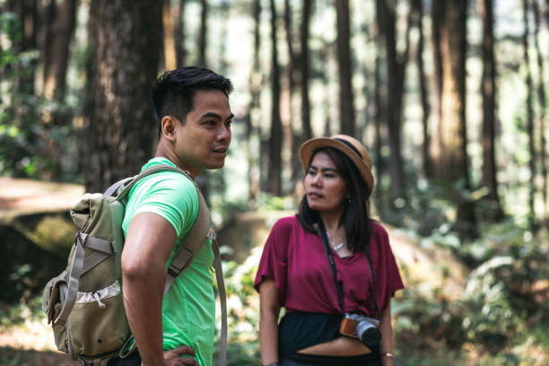 istock man and woman walking on the trail 1338858986