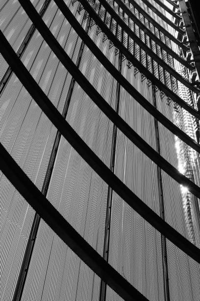 istock Metallic screen with arched support forming abstract urban facade in black and white 1338863018