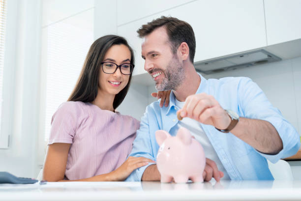 istock Young couple is saving money for their new home 1338863393