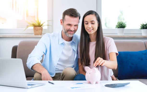 istock Young couple is saving money for their new home 1338863414