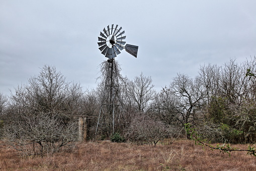 An old windmill in Mountain City Texas.