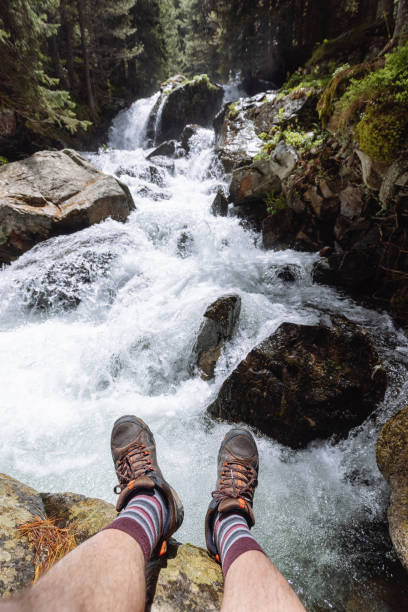 istock Tourist sitting on the river edge 1338864872