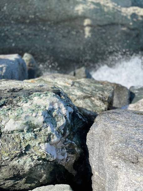 istock Photos on the beach, waves and rocks, pebbles footprints 1338868588