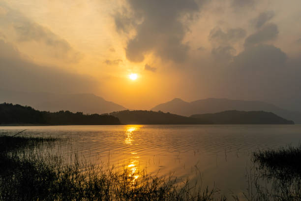 istock The setting sun dyed the sky and the lake yellow, 1338870077