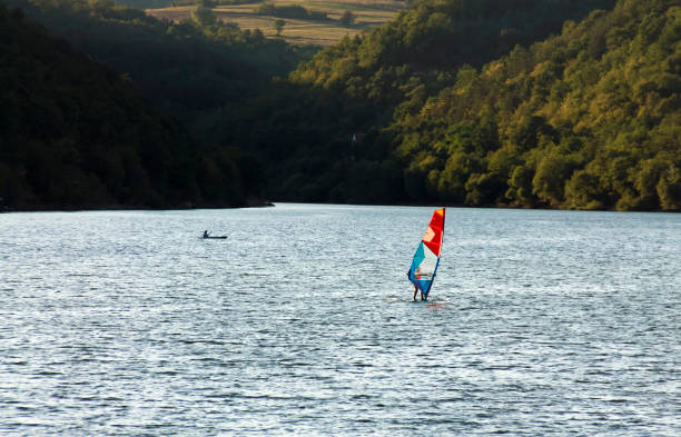 Windsurfing on the lake Windsurfer surfing on the lakec at sunset, kayak in the background .
Adobe RGB color space mistral wind stock pictures, royalty-free photos & images