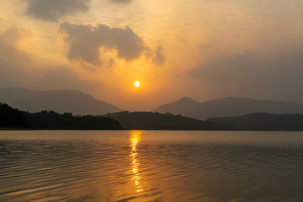 istock The setting sun dyed the sky and the lake yellow, 1338870119
