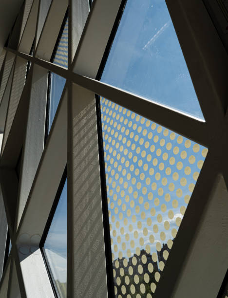 istock Futuristic tirangle windows of a modern financial building 1338870290
