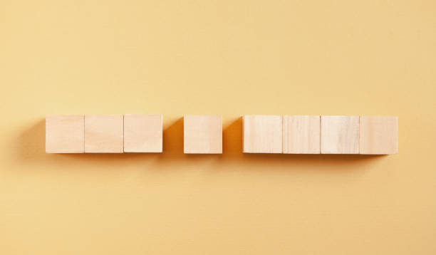 istock Wooden cubes on the yellow background. 1338875963