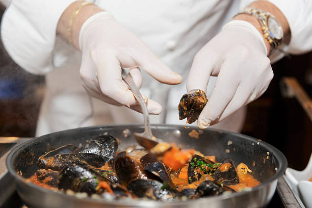 istock Chef frying mussels 133887646