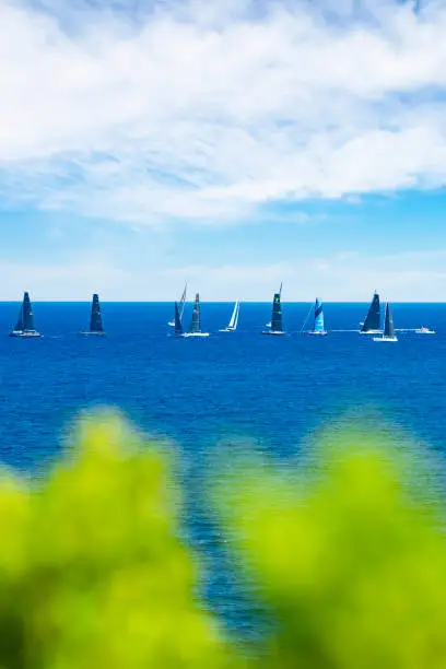 Porto Cervo, Sardinia, Italy, September 07, 2021. Selective focus, stunning view of some sailboats sailing during the Maxi Yacht Rolex Cup in Porto Cervo, Sardinia, Italy.