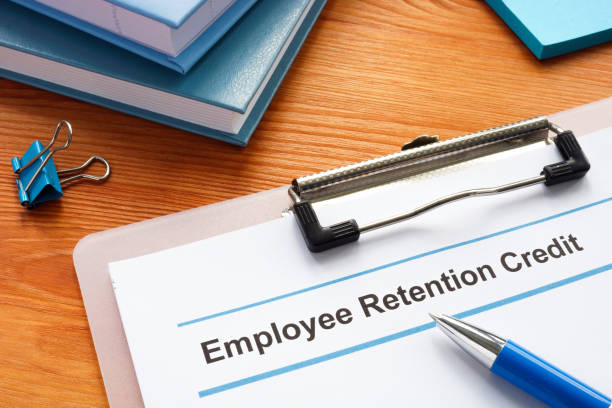 Employee retention credit application and a clipboard. stock photo
