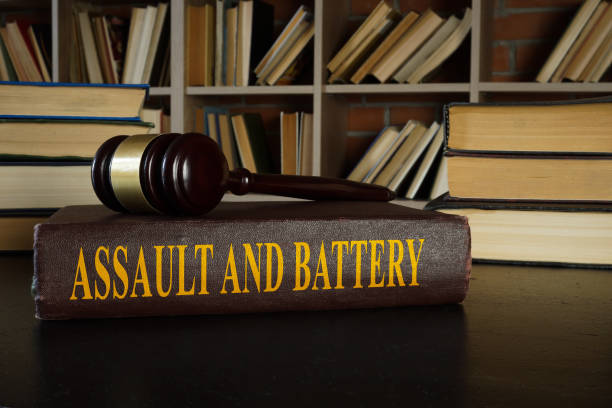 Law about assault and battery and gavel. stock photo